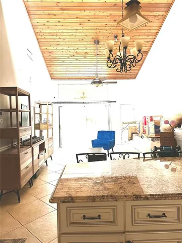 a kitchen with stainless steel appliances granite countertop a stove sink and cabinets