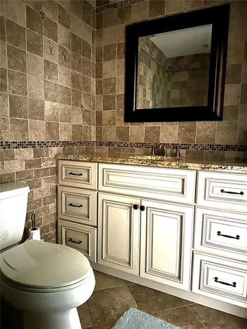 a view of a swimming pool with an outdoor seating and a yard