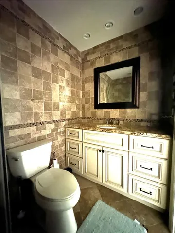 a view of a green field with wooden fence