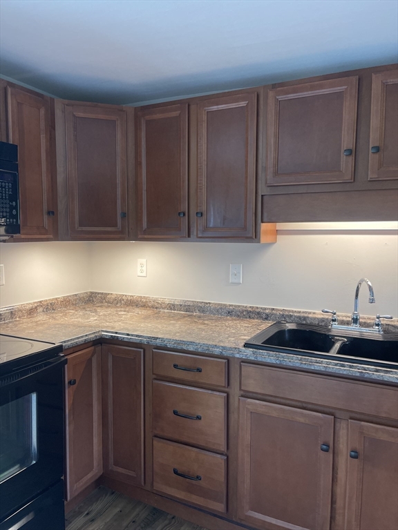 198 North End Road Townsend, MA 01469 - Photo 19 of 37 a kitchen with granite countertop a sink and cabinets