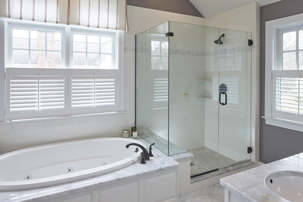 80 Stockdale Road Needham, MA 02492 - Photo 12 of 20 a bathroom with a tub a sink and a window