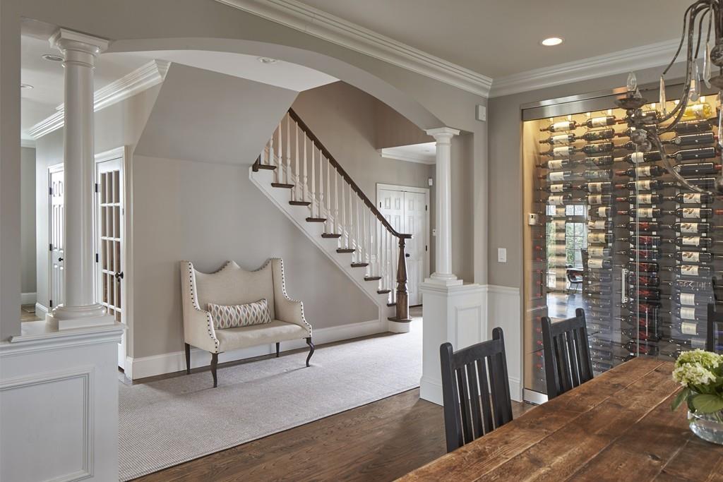 80 Stockdale Road Needham, MA 02492 - Photo 3 of 20 a view of a hallway with wooden floor and stairs