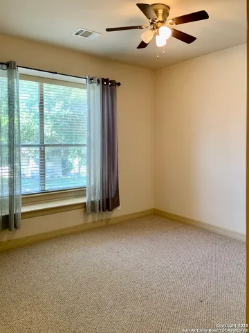 a view of staircase with railing and a chandelier