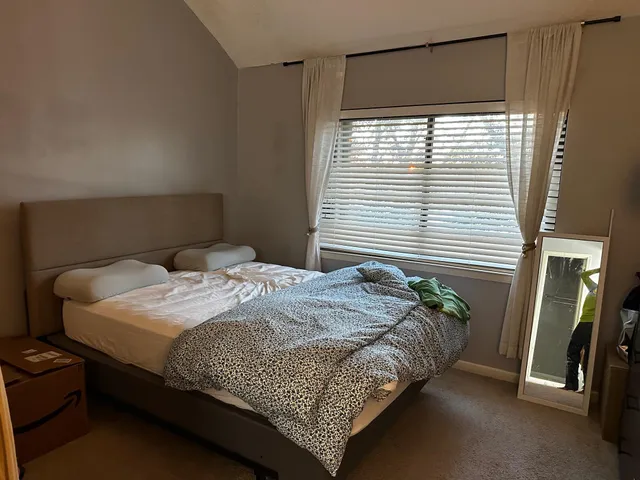 a bathroom with a sink double vanity and mirror