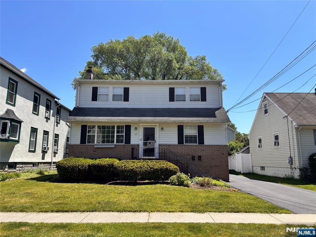 21 Wanamaker Avenue, Unit 1 Waldwick, NJ 07463 - Photo 1 of 13 front view of a house with a yard