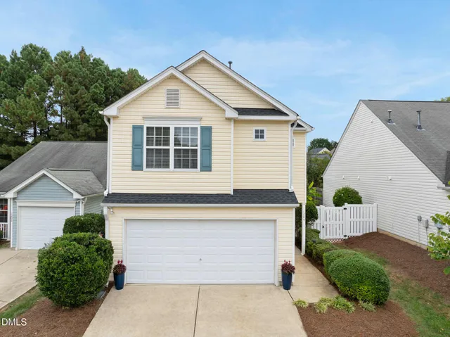 a front view of a house with a garage