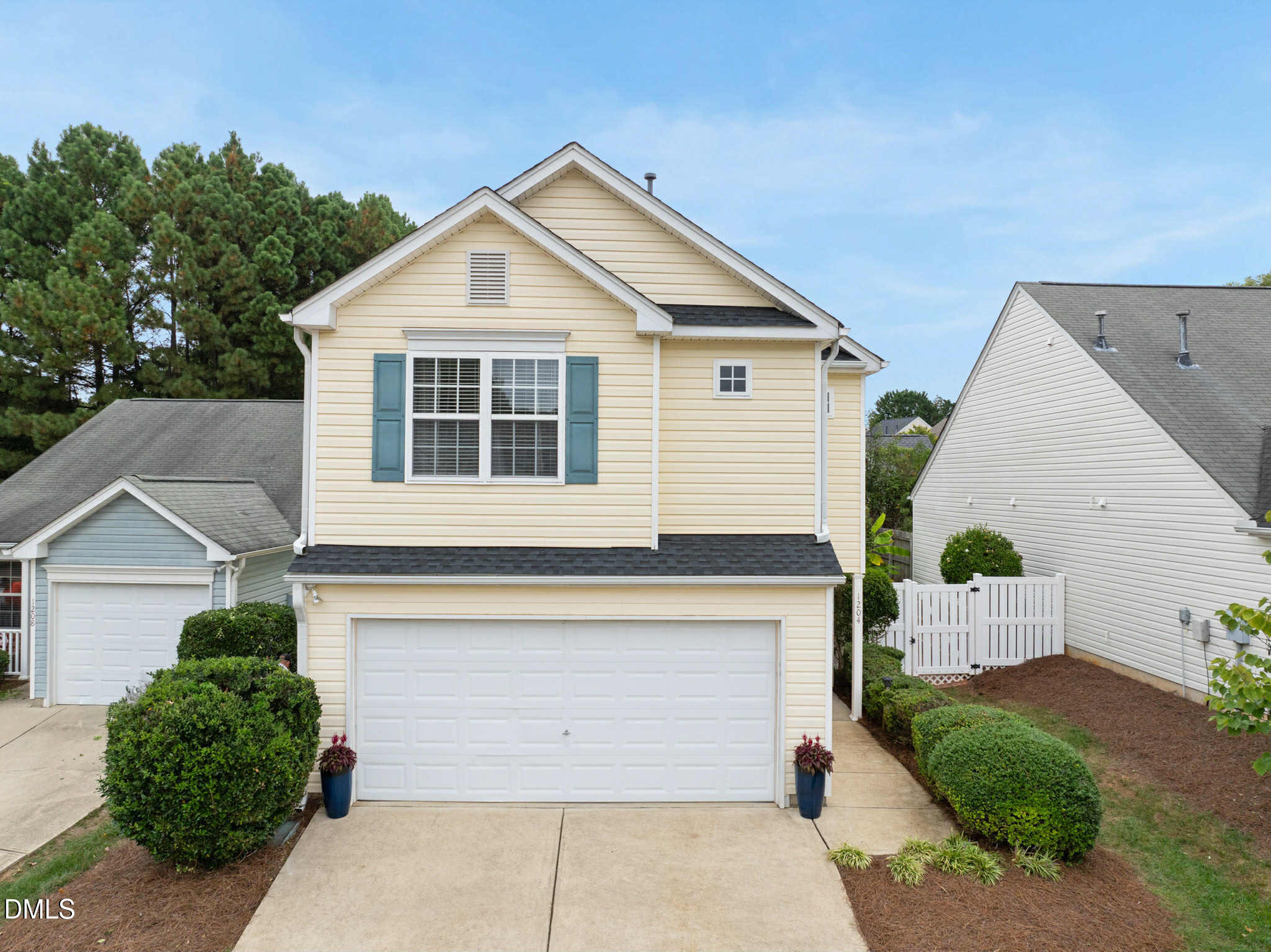 a front view of a house with a garage