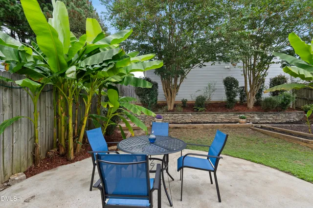 a view of a backyard with sitting area