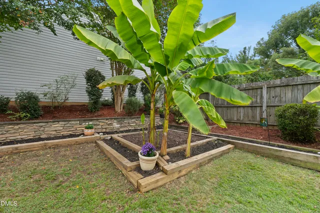 a view of a backyard with sitting area