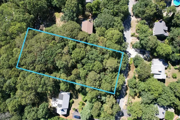 an aerial view of houses with deck and outdoor space