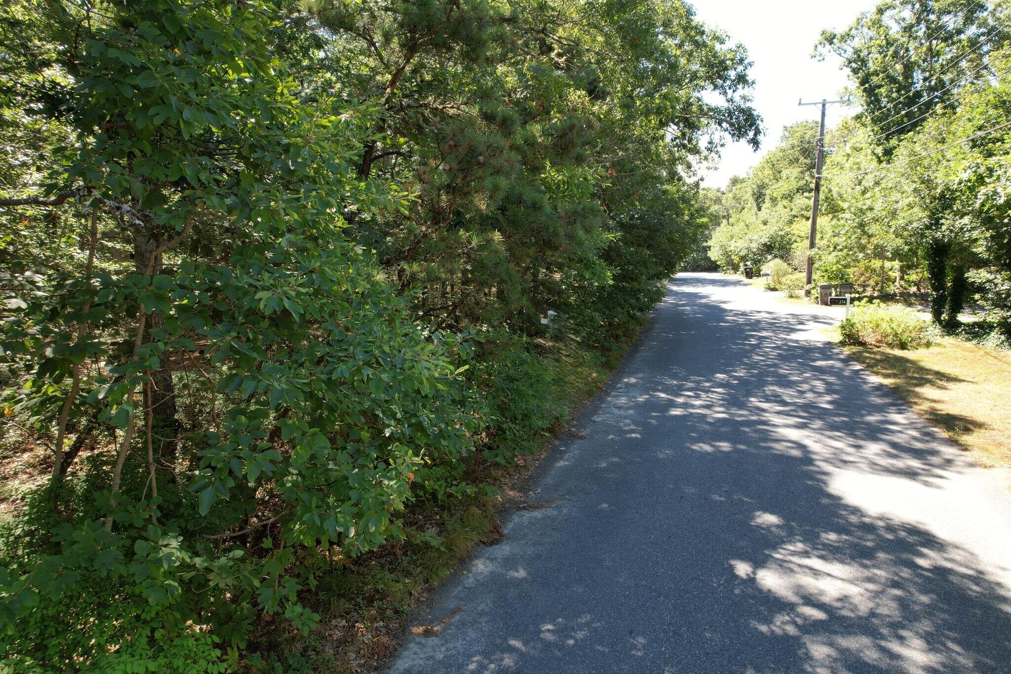 0 Commons Way Brewster, MA 02631 - Photo 8 of 13 a view of a street with a trees