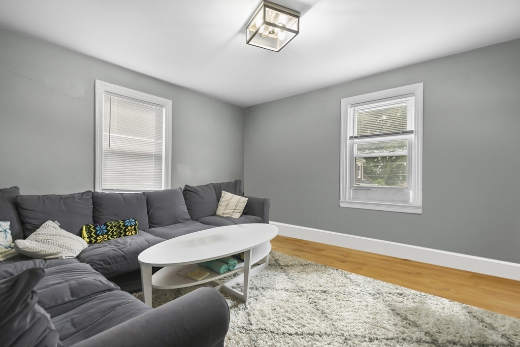 36 Union Street, Unit 36 Woburn, MA 01801 - Photo 3 of 13 a living room with furniture and a window