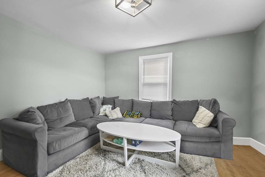 36 Union Street, Unit 36 Woburn, MA 01801 - Photo 4 of 13 a living room with furniture and a couch