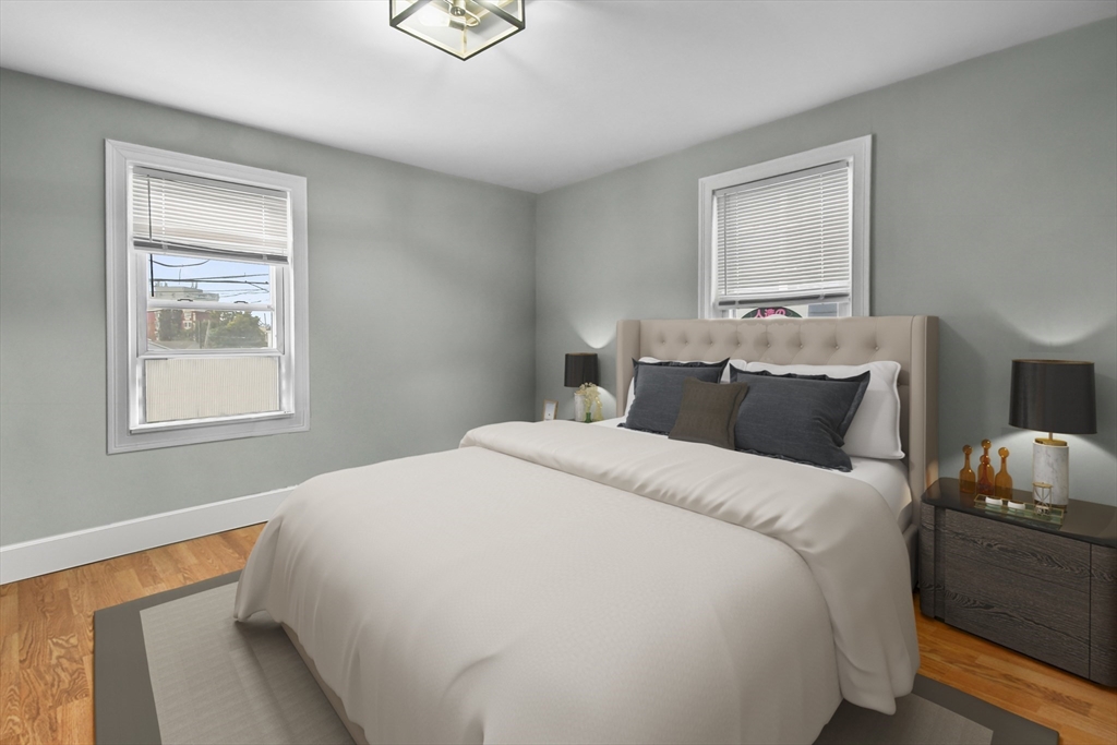 36 Union Street, Unit 36 Woburn, MA 01801 - Photo 5 of 13 a bedroom with a bed and window
