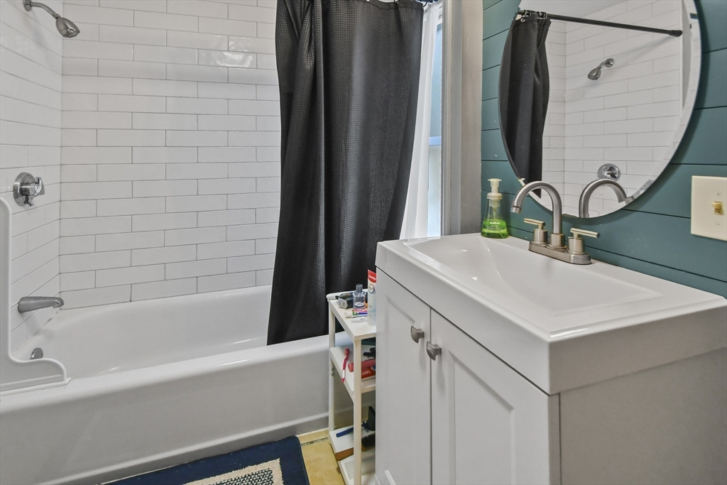 36 Union Street, Unit 36 Woburn, MA 01801 - Photo 7 of 13 a bathroom with a sink and a mirror