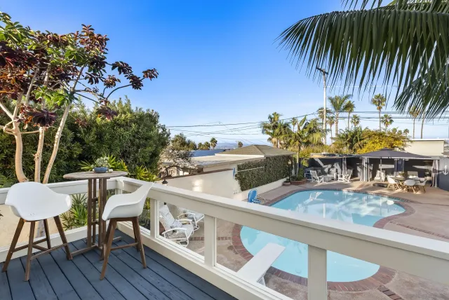 a view of swimming pool with chairs