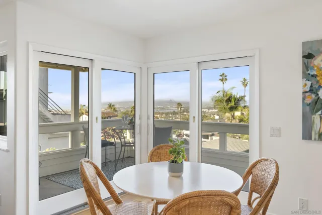 a view of a dining room with furniture window and outside view