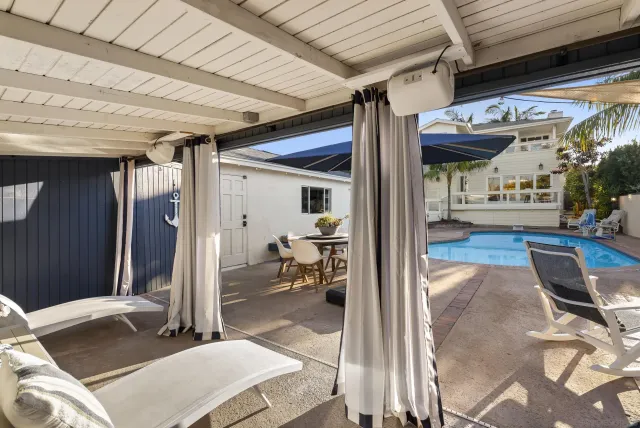 a view of a swimming pool with a patio