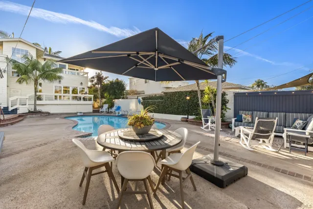 a view of a house with wooden fence