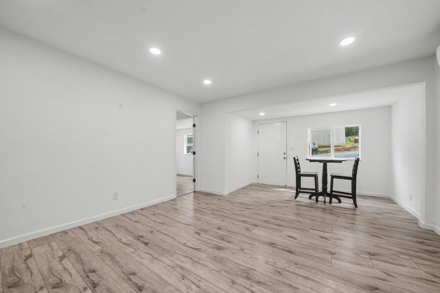 67 Winton Road West Point, CA 95255 - Photo 11 of 28 a view of a work space with wooden floor and a window
