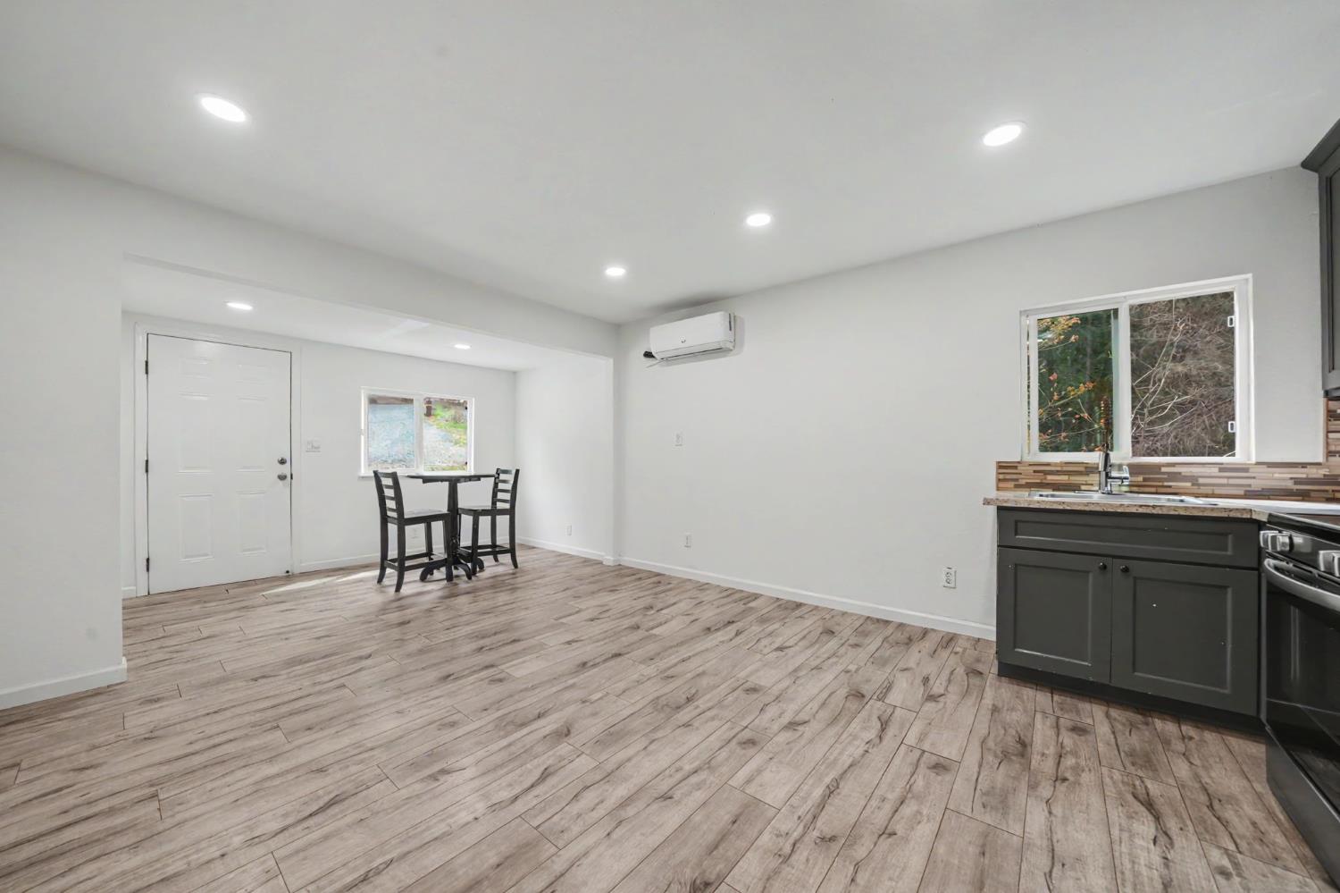 67 Winton Road West Point, CA 95255 - Photo 12 of 28 an empty room with wooden floor and windows