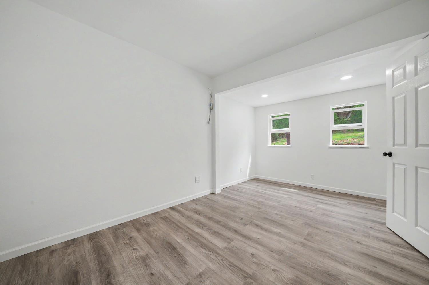 67 Winton Road West Point, CA 95255 - Photo 13 of 28 an empty room with wooden floor and windows
