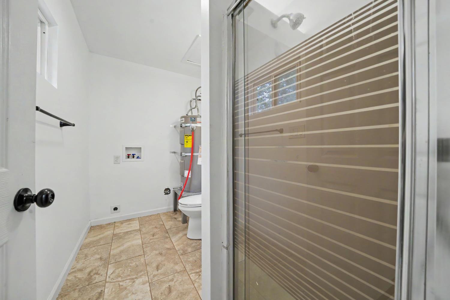 67 Winton Road West Point, CA 95255 - Photo 15 of 28 a bathroom with a toilet and a shower