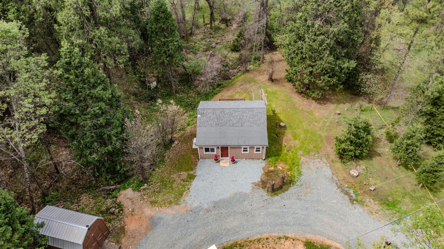 67 Winton Road West Point, CA 95255 - Photo 20 of 28 an aerial view of a house with swimming pool and large trees