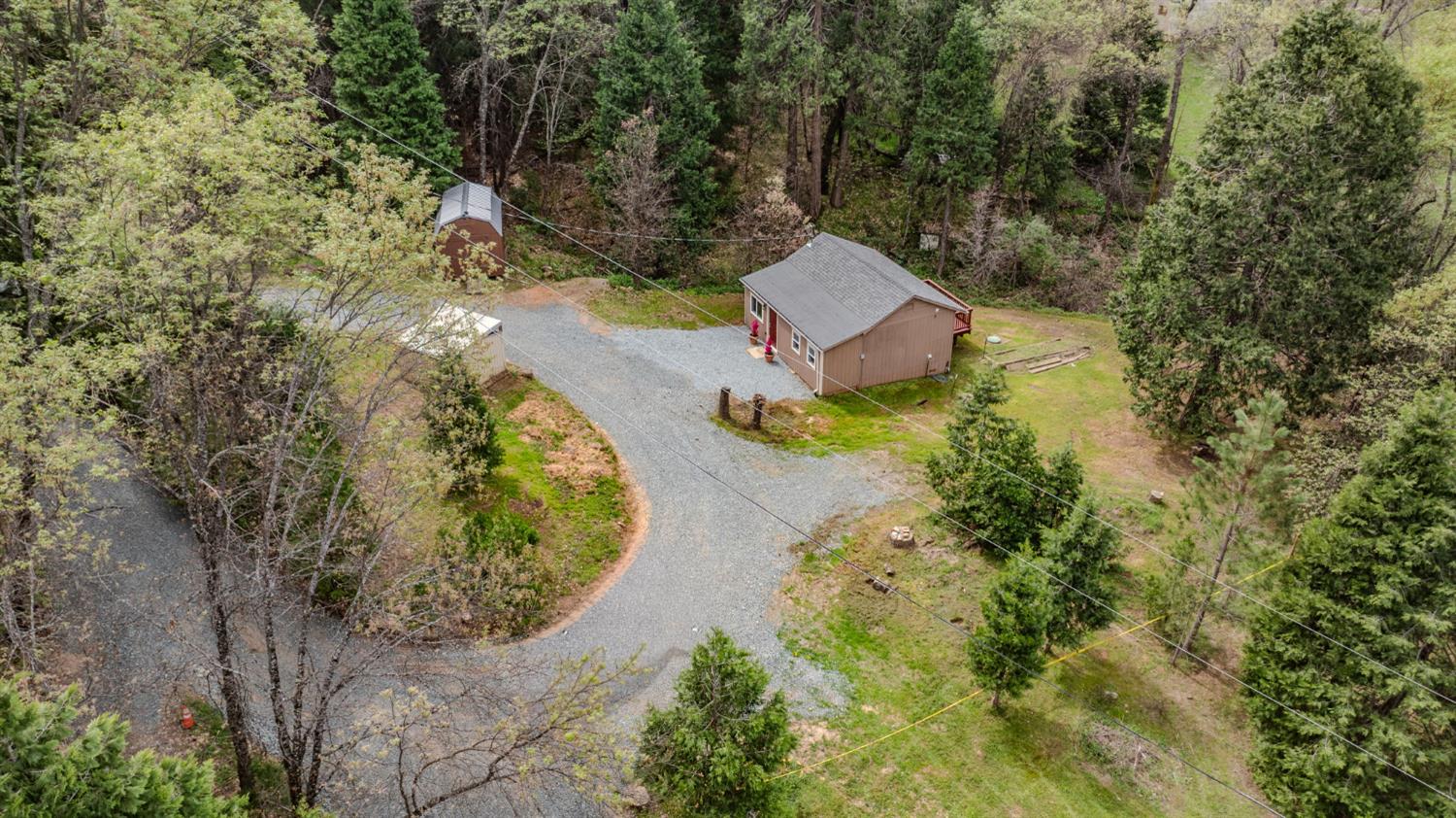 67 Winton Road West Point, CA 95255 - Photo 4 of 28 an aerial view of a house with a yard and lake view