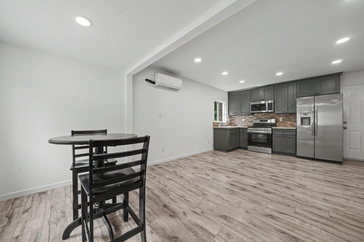 67 Winton Road West Point, CA 95255 - Photo 5 of 28 a kitchen with stainless steel appliances kitchen island granite countertop a refrigerator and a stove top oven