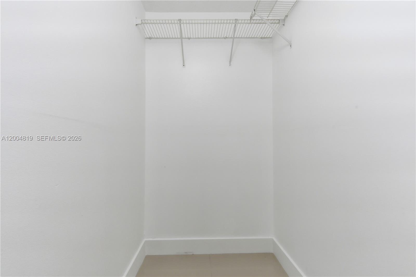 3725 Southwest 153rd Court Miami, FL 33185 - Photo 14 of 28 a view of a room with racks on the wall