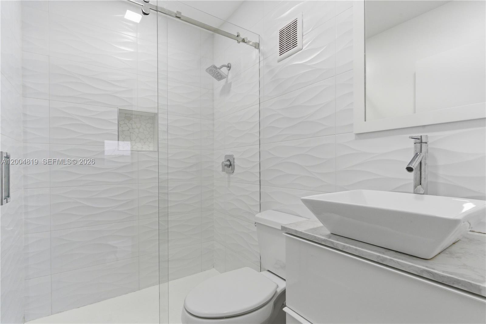 3725 Southwest 153rd Court Miami, FL 33185 - Photo 22 of 28 a bathroom with a sink a toilet and shower