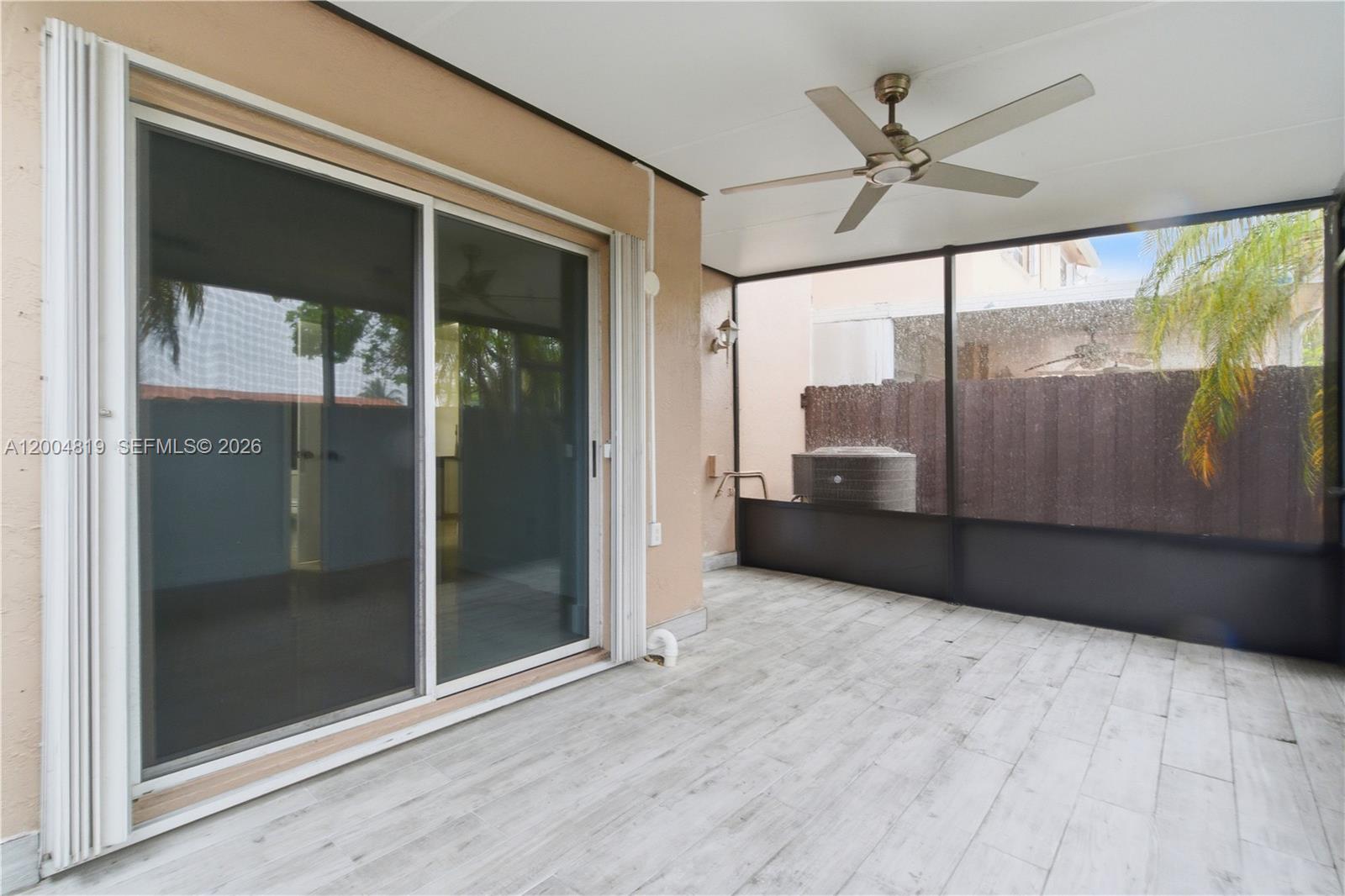 3725 Southwest 153rd Court Miami, FL 33185 - Photo 28 of 28 a view of a big room with wooden floor and windows
