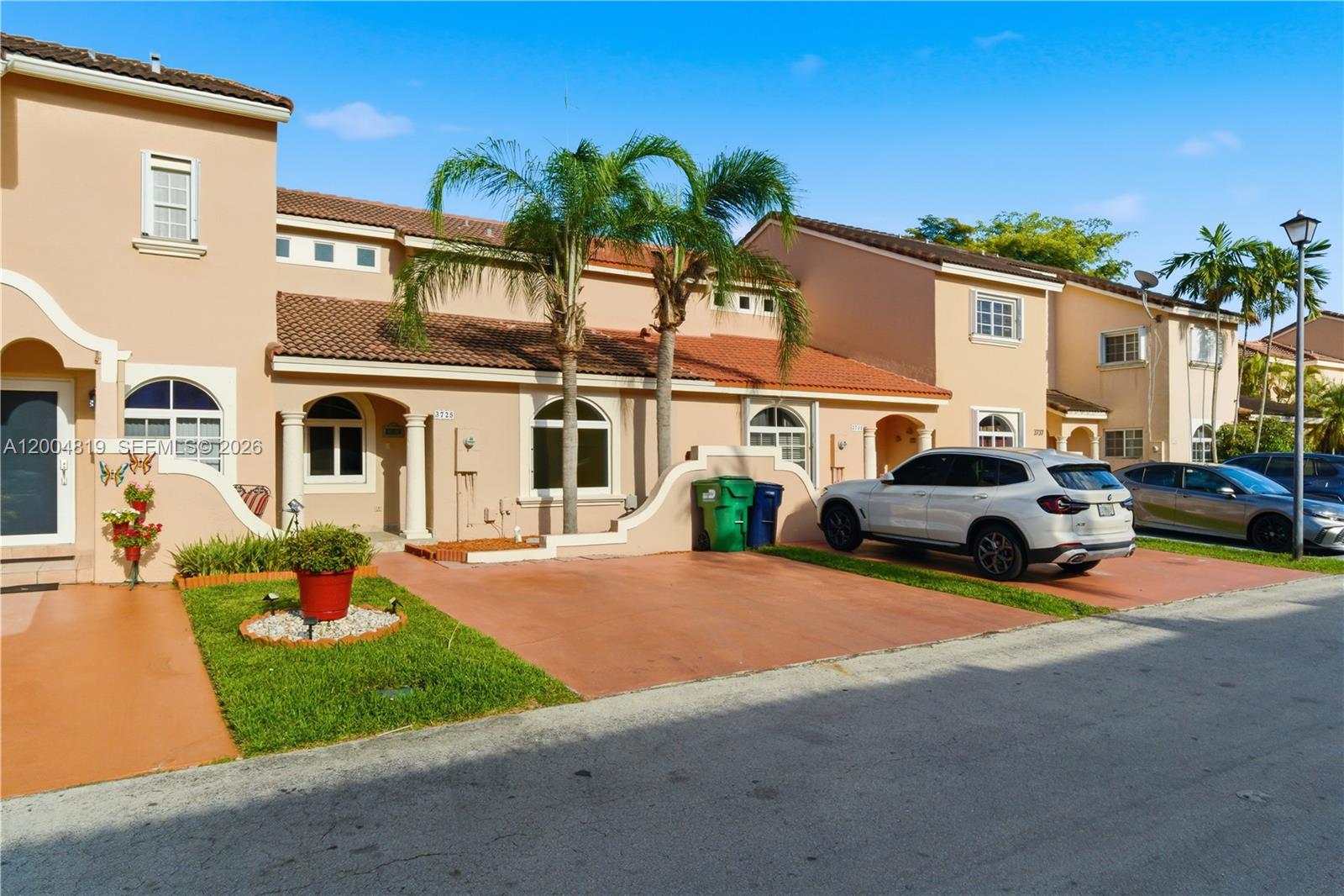 3725 Southwest 153rd Court Miami, FL 33185 - Photo 3 of 28 a front view of a house with garden