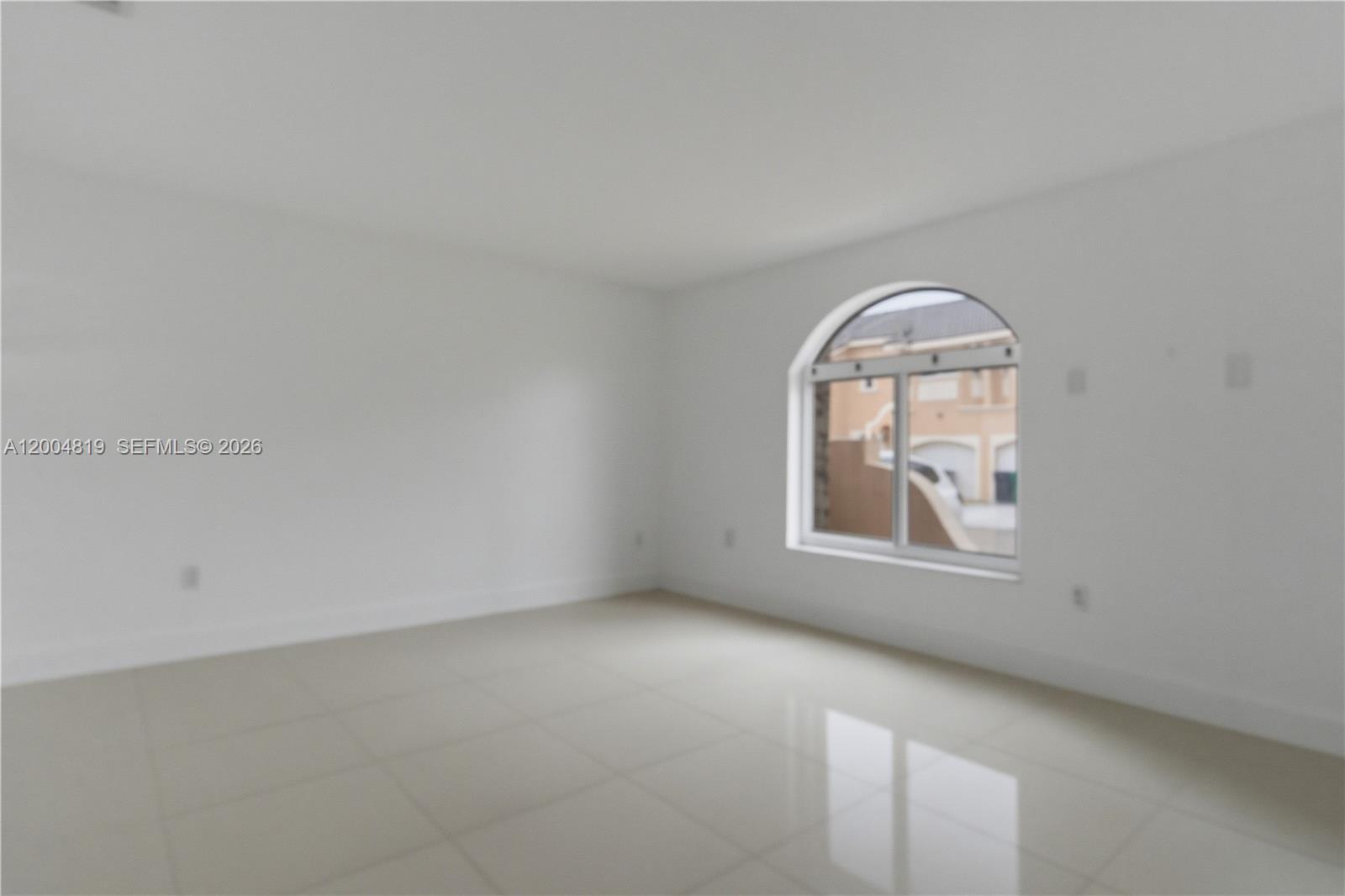 3725 Southwest 153rd Court Miami, FL 33185 - Photo 7 of 28 an empty room with a window