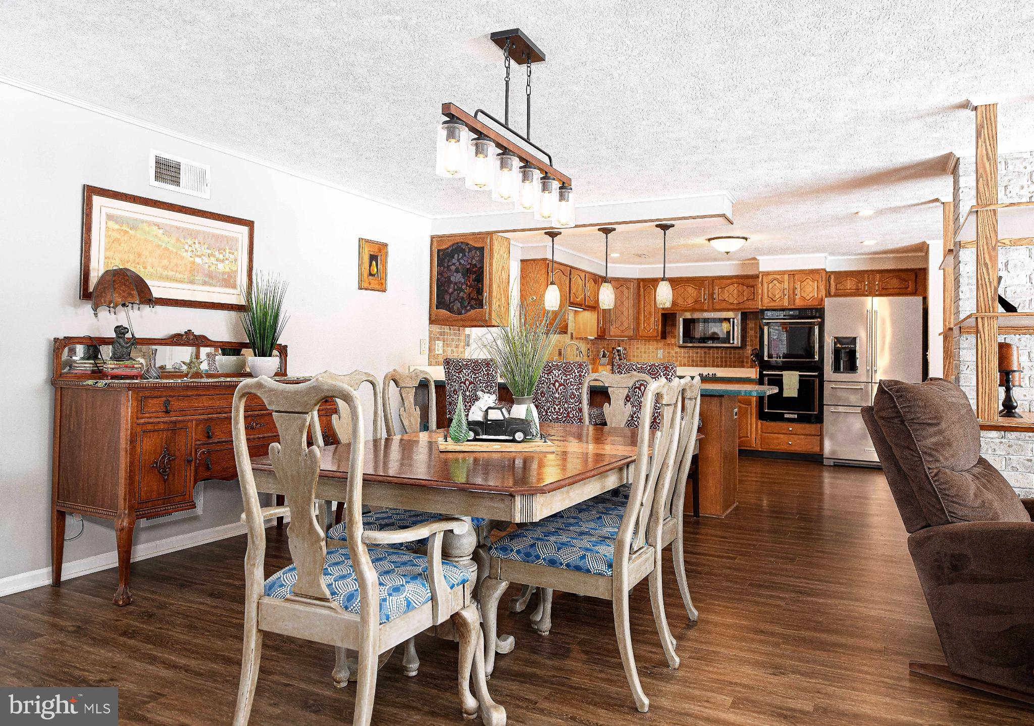 1221 Prospect Mill Road Bel Air, MD 21015 - Photo 25 of 81 a dining room with furniture a chandelier and wooden floor
