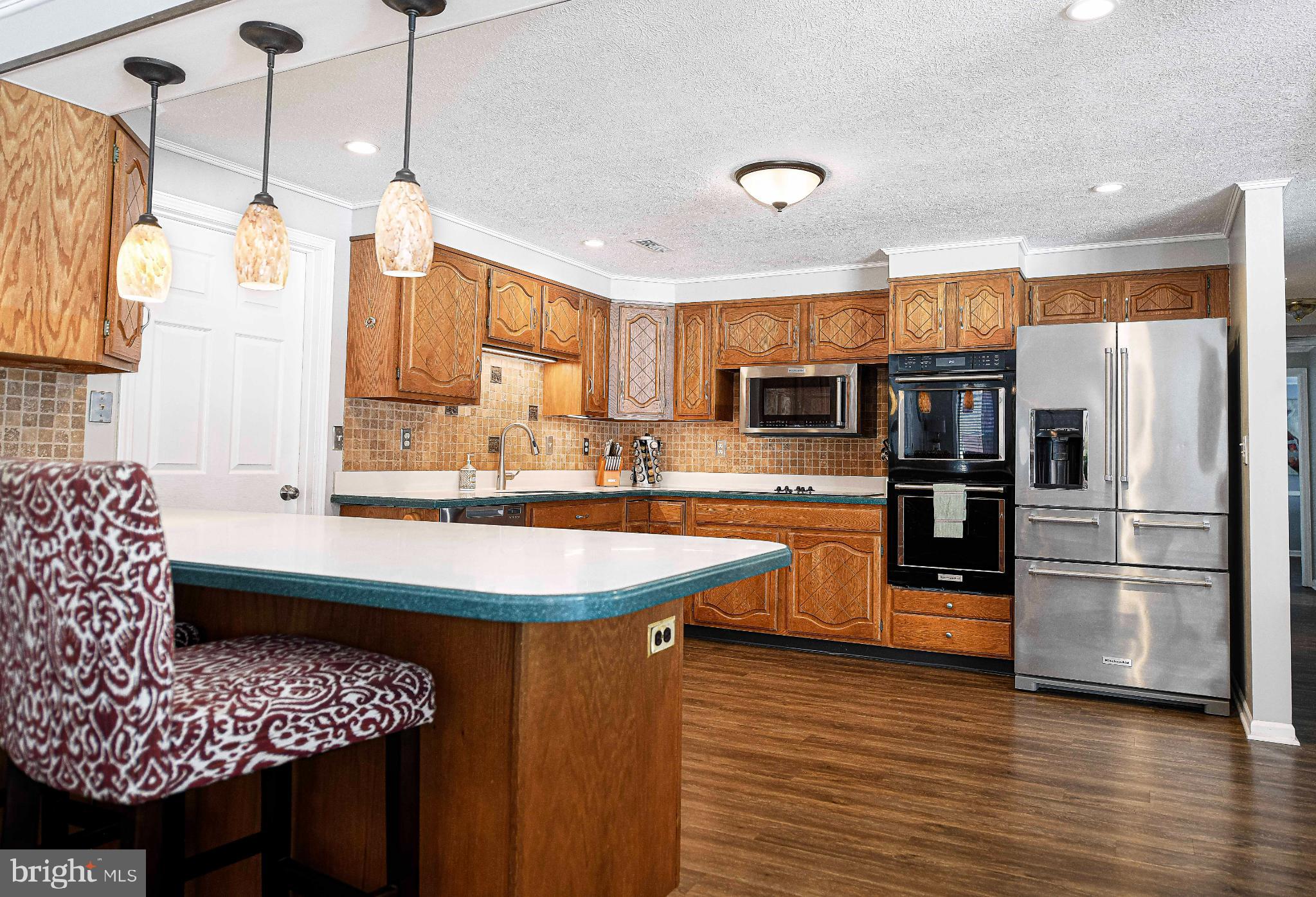 1221 Prospect Mill Road Bel Air, MD 21015 - Photo 27 of 81 a kitchen with stainless steel appliances granite countertop a sink a stove and a refrigerator