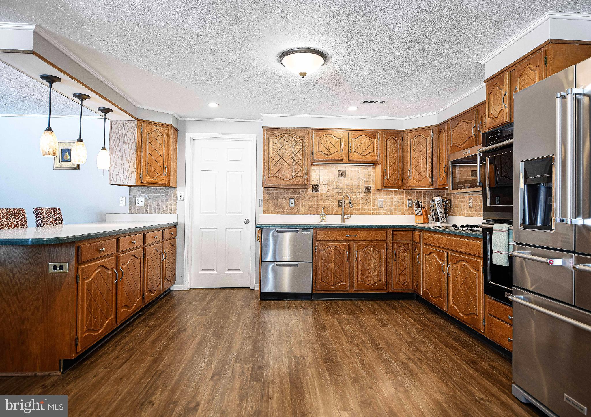 1221 Prospect Mill Road Bel Air, MD 21015 - Photo 28 of 81 a kitchen with stainless steel appliances a sink cabinets and wooden floor