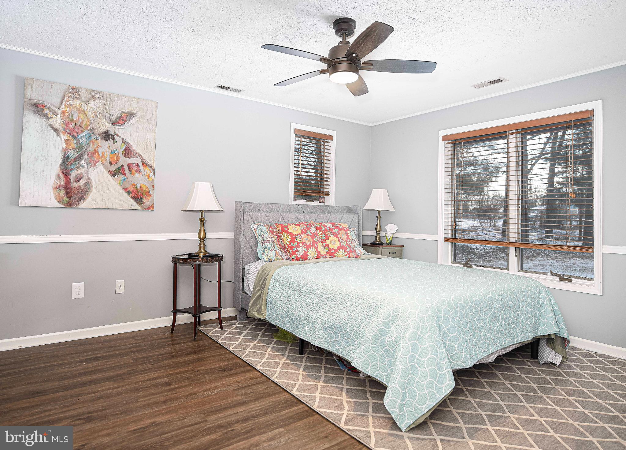 1221 Prospect Mill Road Bel Air, MD 21015 - Photo 31 of 81 a bedroom with a large bed and a chandelier