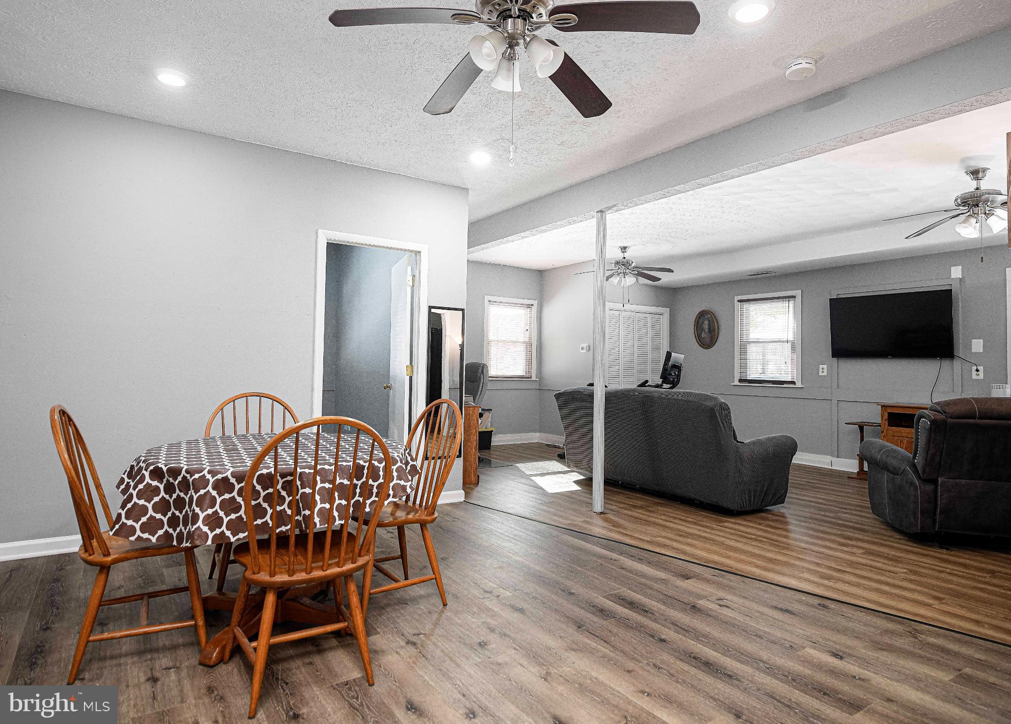 1221 Prospect Mill Road Bel Air, MD 21015 - Photo 44 of 81 a living room with furniture a flat screen tv and a chandelier