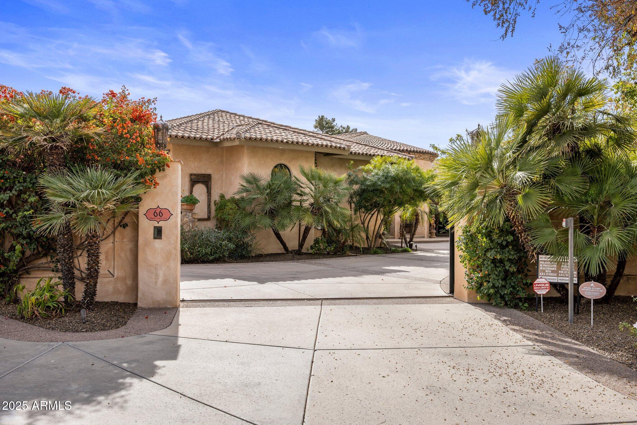 66 Biltmore Estates Drive Phoenix, AZ 85016 - Photo 2 of 54 a front view of a house with garden