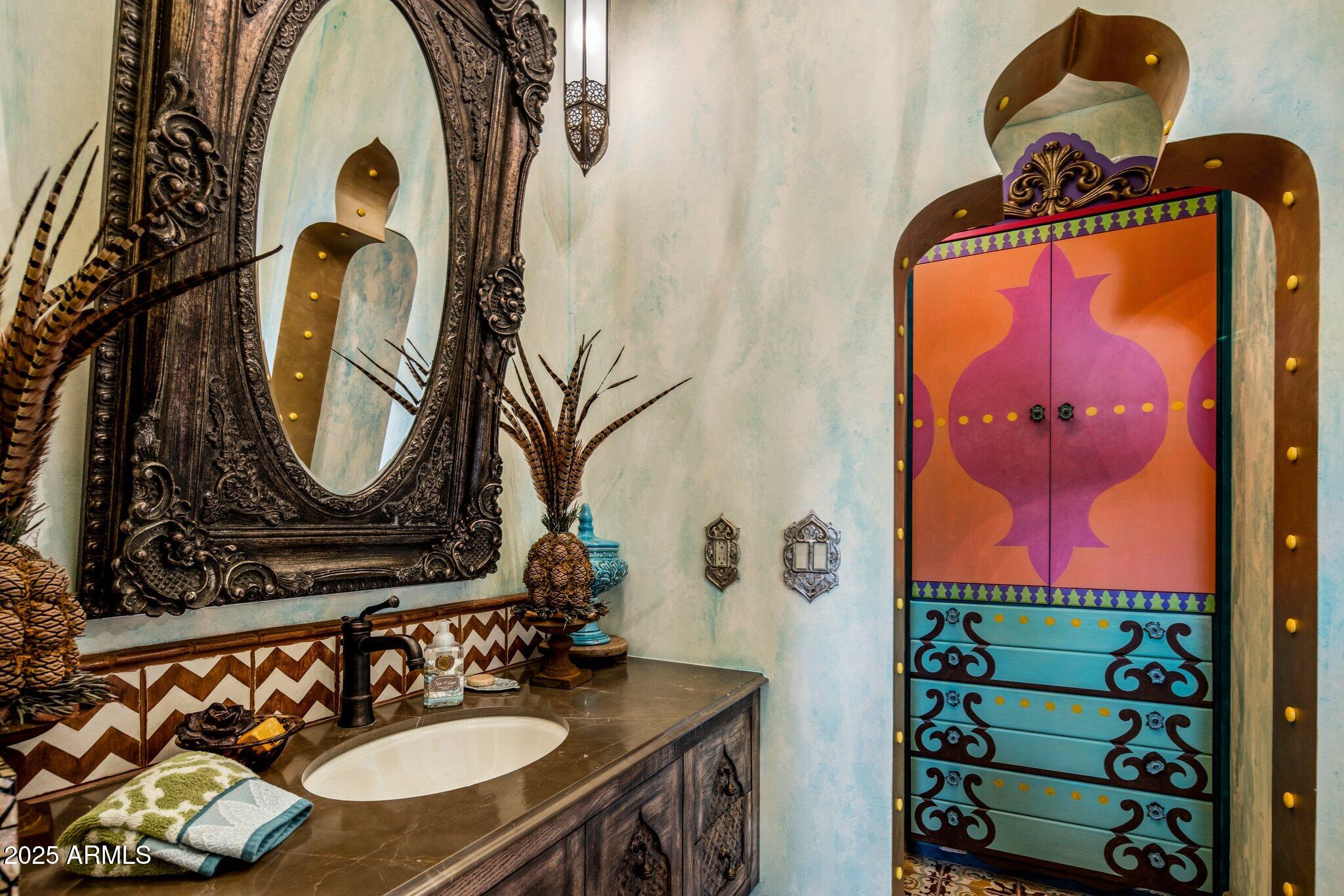 66 Biltmore Estates Drive Phoenix, AZ 85016 - Photo 33 of 54 a bathroom with a sink mirror and vanity