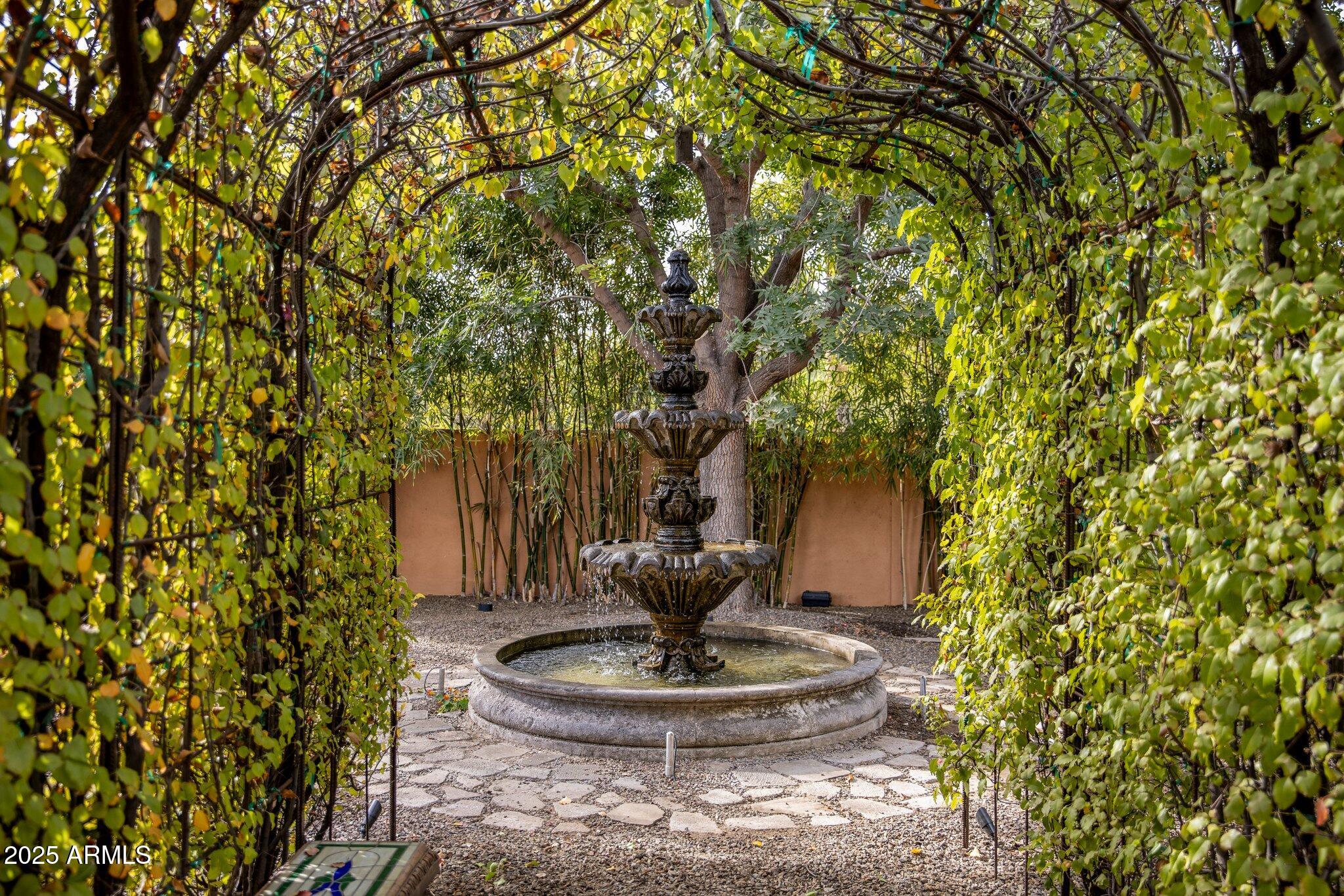 66 Biltmore Estates Drive Phoenix, AZ 85016 - Photo 5 of 54 a vase of flower sitting on a table