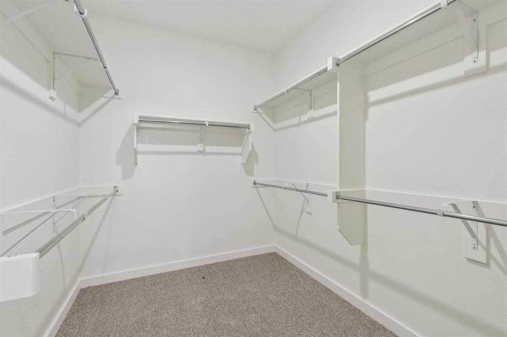 1469 Barbacoa Drive Haslet, TX 76052 - Photo 18 of 35 a view of a room with racks on the wall