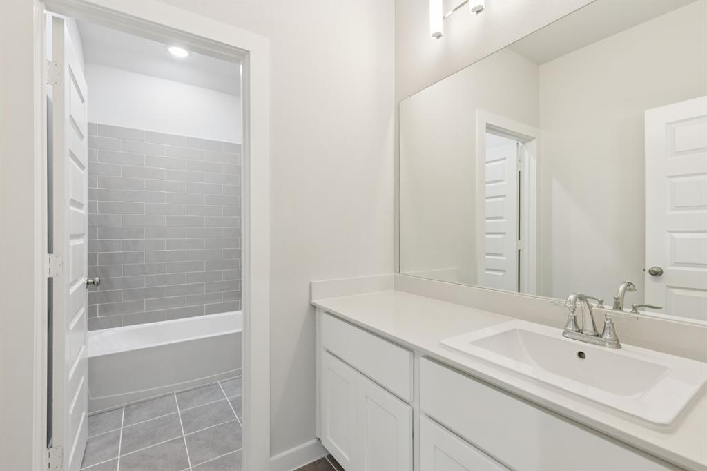 1469 Barbacoa Drive Haslet, TX 76052 - Photo 29 of 35 a bathroom with a sink and a mirror