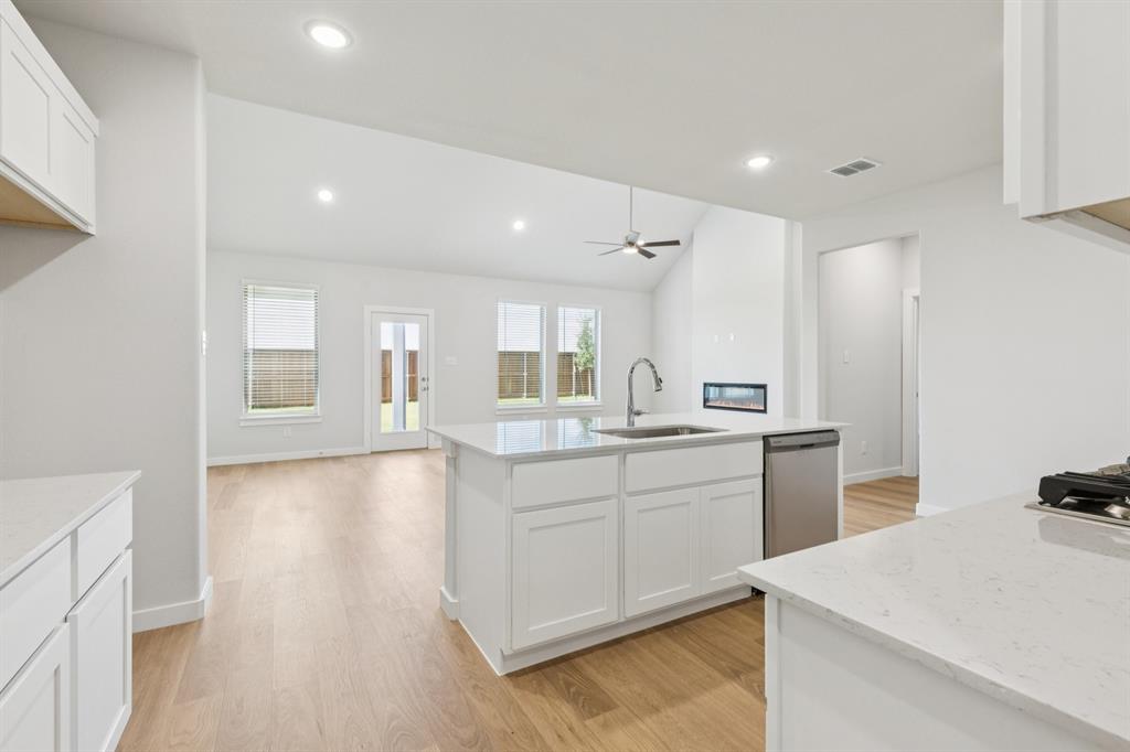 1469 Barbacoa Drive Haslet, TX 76052 - Photo 10 of 35 a kitchen with sink and refrigerator
