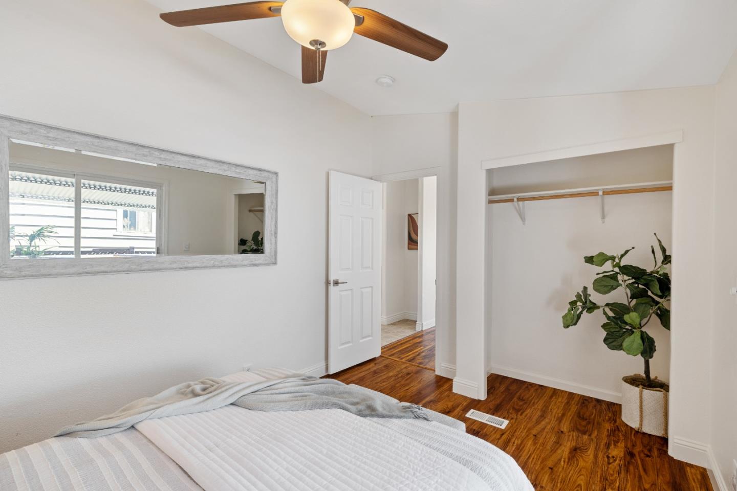 14685 Oka Road, Unit 62 Los Gatos, CA 95032 - Photo 13 of 27 a bedroom with a bed and a potted plant