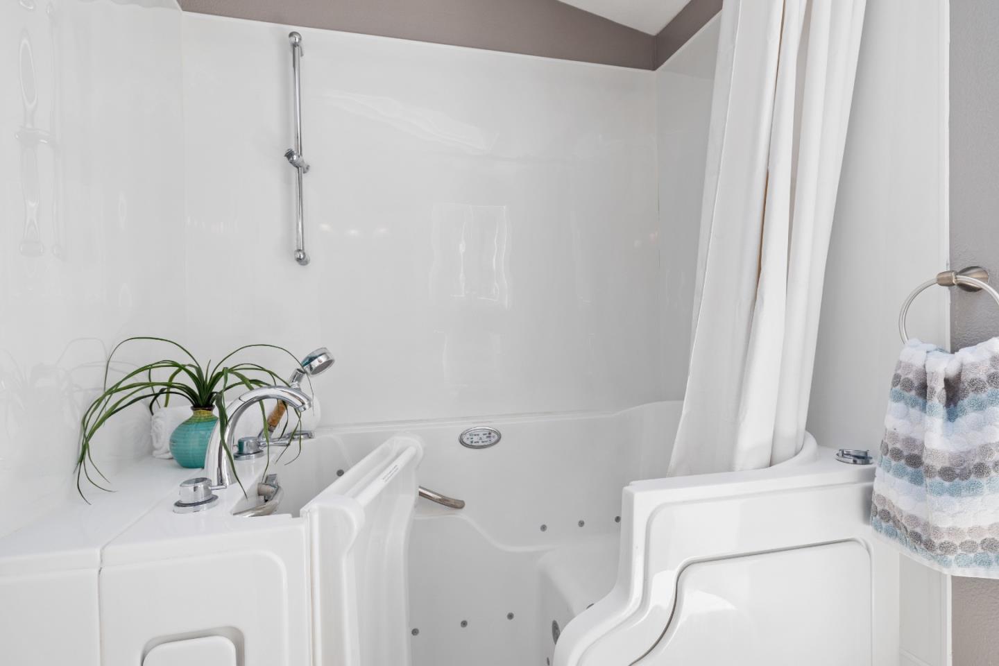 14685 Oka Road, Unit 62 Los Gatos, CA 95032 - Photo 15 of 27 a bathroom with a sink a toilet and shower