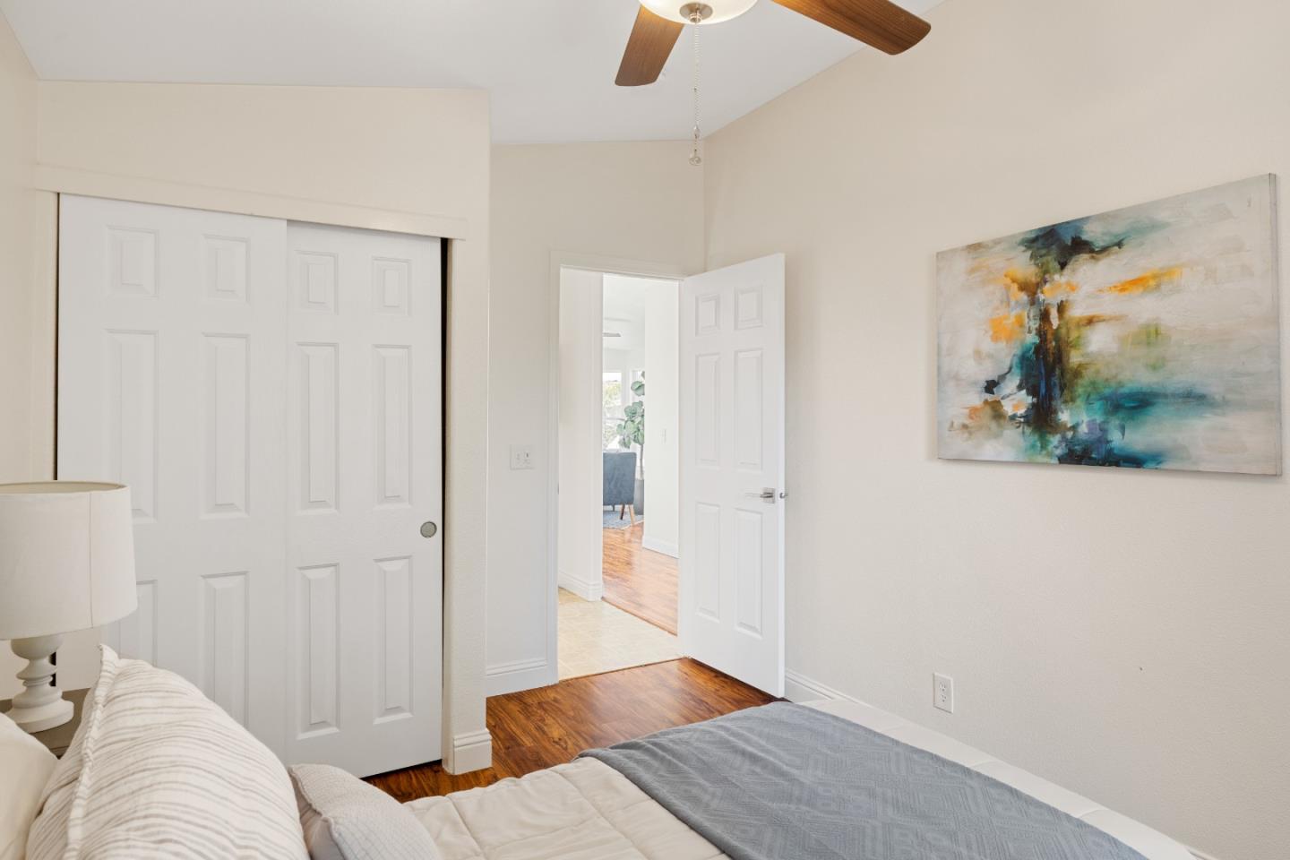 14685 Oka Road, Unit 62 Los Gatos, CA 95032 - Photo 17 of 27 a view of a bedroom with furniture and wooden floor
