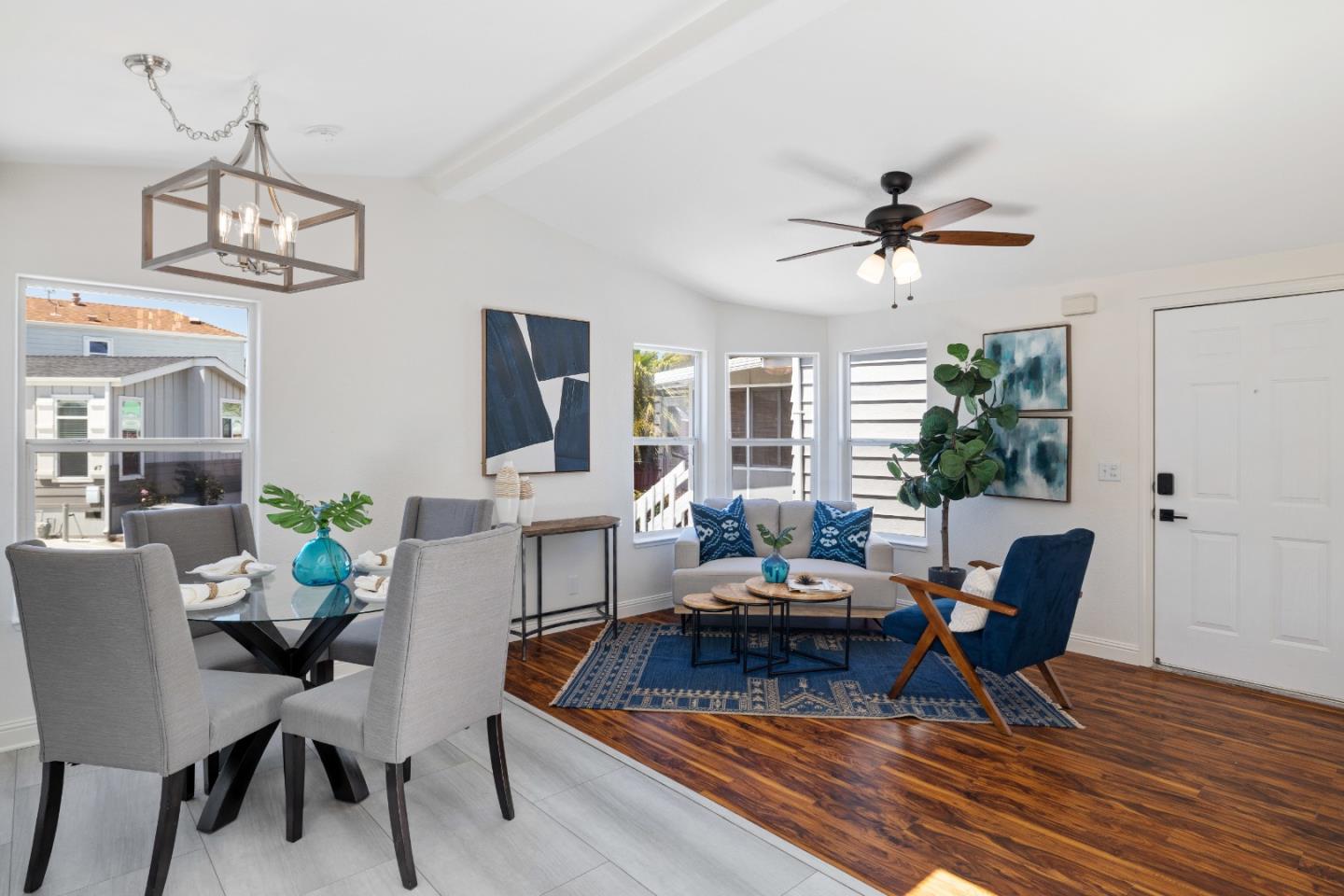 14685 Oka Road, Unit 62 Los Gatos, CA 95032 - Photo 2 of 27 a living room with furniture a chandelier and a window